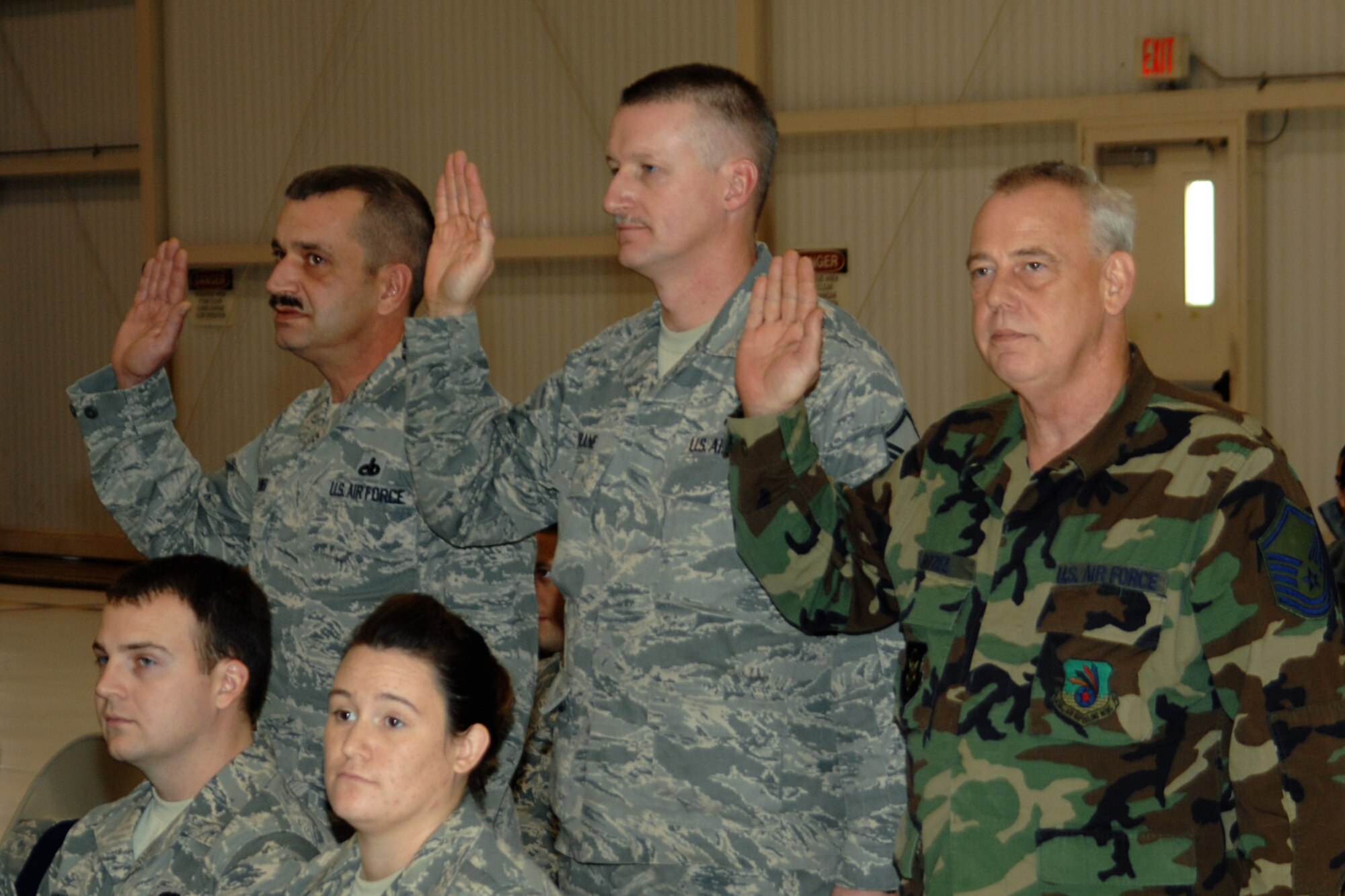 GRISSOM AIR RESERVE BASE, Ind. -- From left, Master Sgts. Rodney Waikel, Charles Drane and John E. Bitzel, Jr., recite a senior noncommissioned officer pledge during a special induction ceremony held during the November unit training assembly. The ceremony recognized the three new master sergeants as senior NCOs.  Sergeant Waikel is a pneudraulic systems supervisor with the 434th Maintenance Squadron; Sergeant Drane is a KC-135R Stratotanker crew chief with the 434t Aircraft Maintenance Squadron; and Sergeant Bitzel is a combat crew communications specialist with the 434th Operations Support Squadron.  (U.S. Air Force photo/Senior Airman Carl Berry)
