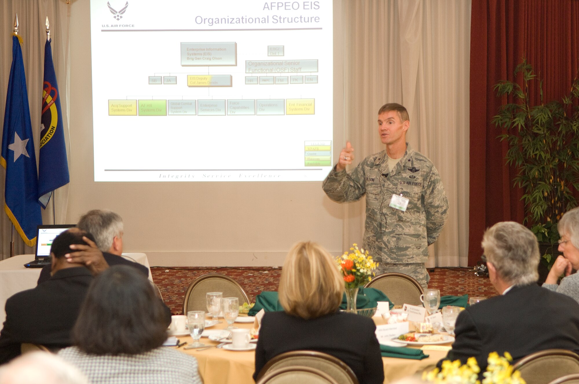 Brig. Gen. Craig Olson, Air Force program executive officer for Enterprise Information Systems, talks with members of the Hanscom Representatives Association during their monthly luncheon meeting at Hanscom’s Minuteman Club Nov. 16.  General Olson talked about the necessity of enterprise information systems, the challenge of managing them and his desire for genuine partnership with industry.  (U.S. Air Force Photo by Mark Wyatt.) 