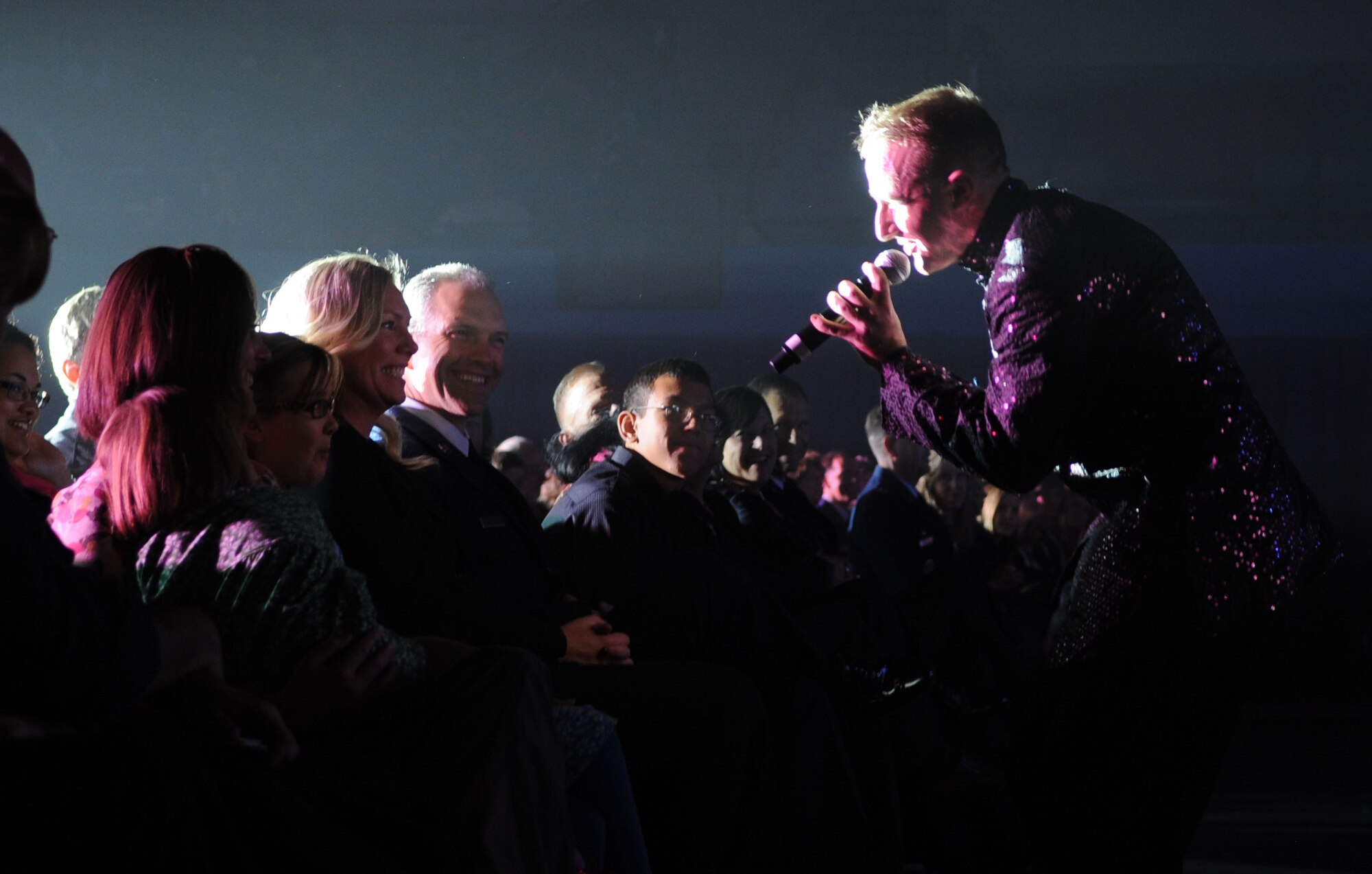 HAMPTON, Va. -- Staff Sgt. Steven Sooner, Tops in Blue vocalist, sings to crowd members during the Tops in Blue 2010 We Believe tour at the Hampton University Convocation Center Nov. 12. Tops in Blue are made up of active-duty Airmen from all over the Air Force, more than 2,000 people came out to the free performance where the group performed 25 songs from a variety of genres to include R&B and rock ‘n’ roll. (U.S. Air Force photo/ Senior Airman David Mueller)(RELEASED)