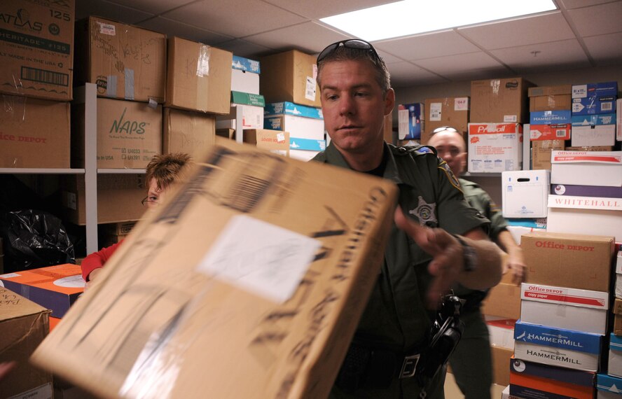 MacDill Air Force Base, Fla. -- Deputy Kevin Shea understands what it is to serve.  As a member of the Hillsborough County Sheriff's Office, he spends his working hours serving the citizens of Tampa.  In his off time, he volunteers with Operation Patriot.  This charity, started in part by local law enforcement, provides veterans at the Baldomero State Veterans Nursing Home everything from toiletries to video games - items not covered under the veterans' $35 a month allowance.  Thornton recently helped deliver 239 boxes to the nursing home on Veteran's Day.  (Official United States Air Force photo by Staff Sgt. Shawn C. Rhodes)