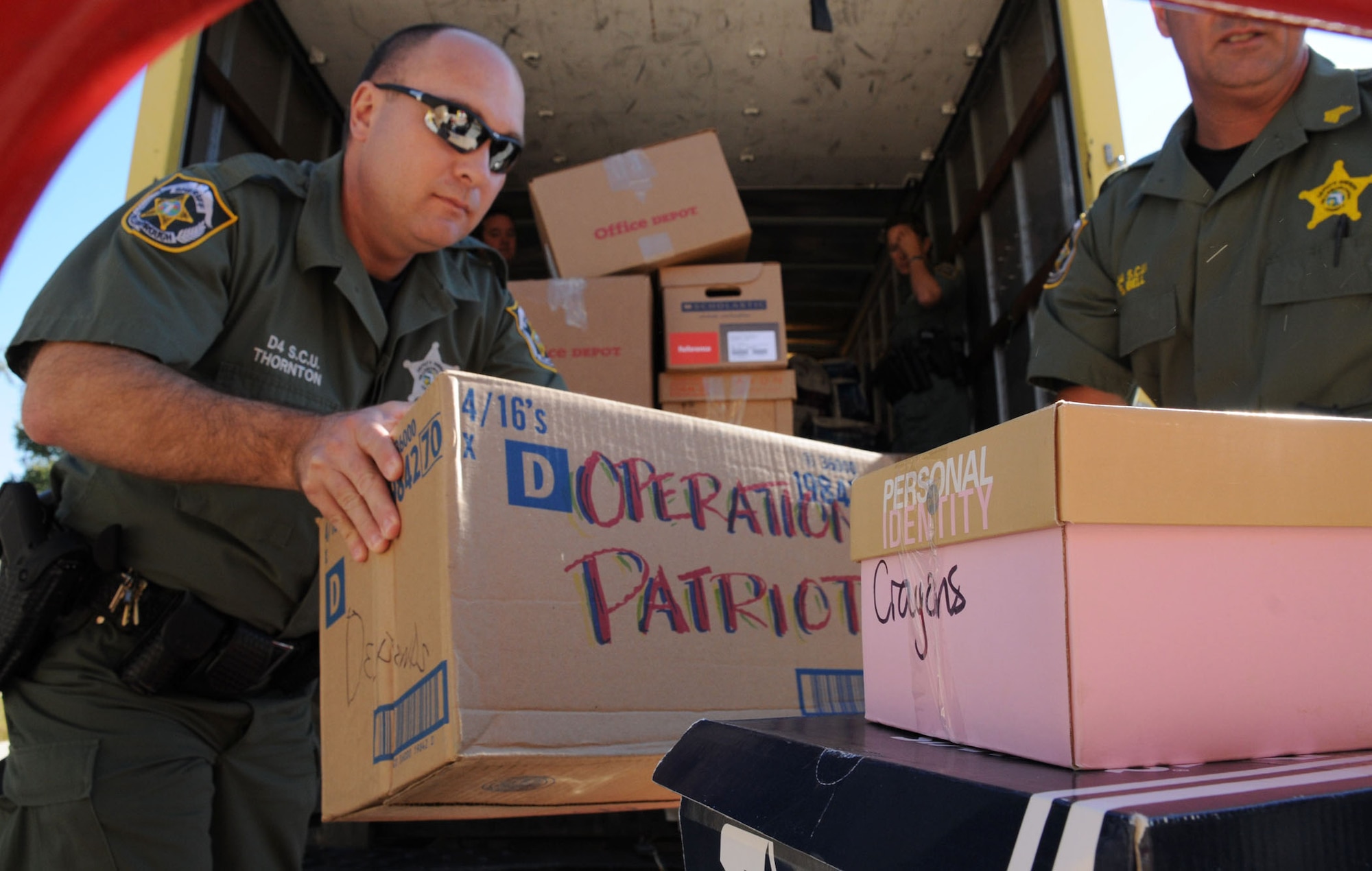 MacDill Air Force Base, Fla. -- Deputy Robert Thornton understands what it is to serve.  As a member of the Hillsborough County Sheriff's Office, he spends his working hours serving the citizens of Tampa.  In his off time, he volunteers with Operation Patriot.  This charity, started in part by local law enforcement, provides veterans at the Baldomero State Veterans Nursing Home everything from toiletries to video games - items not covered under the veterans' $35 a month allowance.  Thornton recently helped deliver 239 boxes to the nursing home on Veteran's Day.  (Official United States Air Force photo by Staff Sgt. Shawn C. Rhodes)