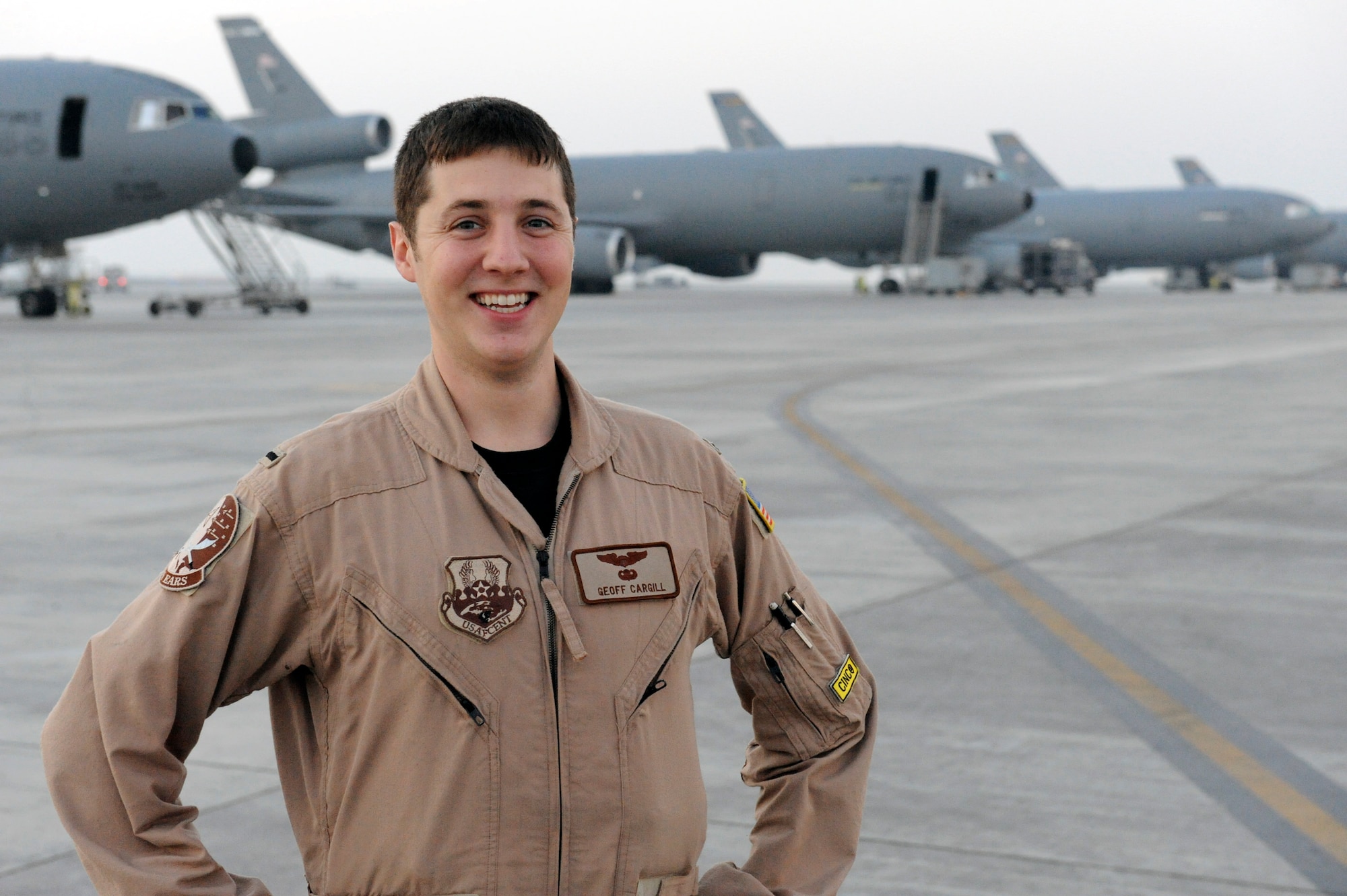 1st Lt. Geoff Cargill, 908th Expeditionary Air Refueling Squadron, poses on the flightline at an undisclosed location in Southwest Asia. Lieutenant Cargill has accumulated more than 100 missions and 1,100 hours of flight in his first year as a pilot. (U.S. Air Force photo/ Staff. Sgt. Jeremy Larlee)