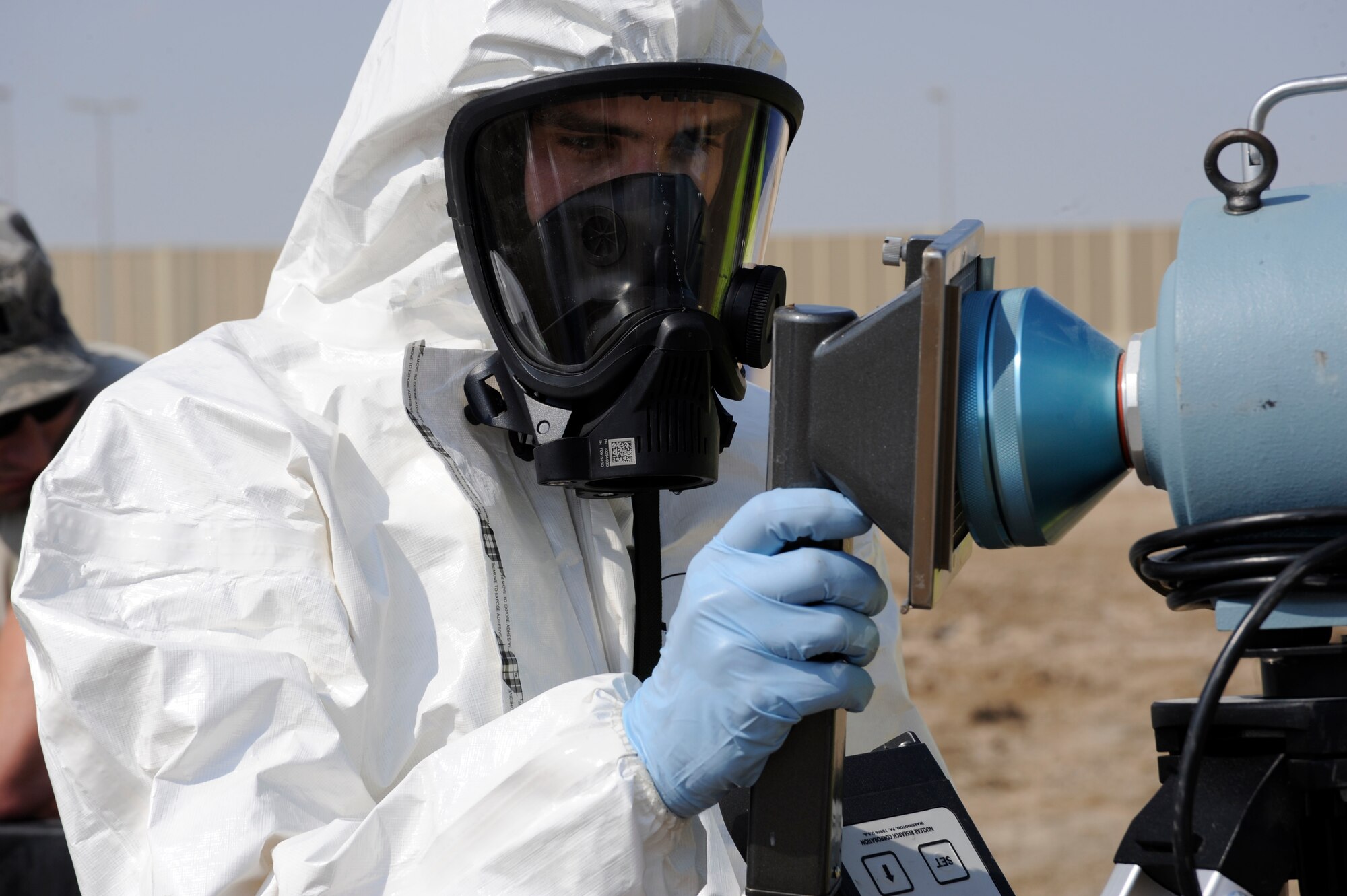 Airman 1st Class Zachary Certain, 380th Expeditionary Civil Engineer Squadron emergency management journeyman, uses an ADM 300 to simulate testing for the presence of Alpha Particulate Radiation on the front of the RADECO air sampler Nov. 13, 2010 during a joint bio environmental/emergency management exercise at an undisclosed location in Southwest Asia. During the exercise Airmen from the 380th ECES and 380th Expeditionary Medical group practiced responding to an unknown hazard, and monitored for chemical, biological and radiological hazards. The Airmen were tested on use of the equipment and their knowledge the readings they were receiving. (U.S. Air Force photo/ Tech. Sgt. April Wickes)