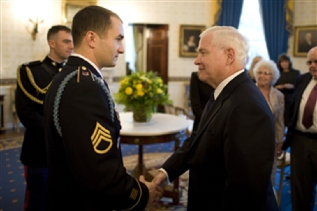 U.S. Army Staff Sgt. Salvatore Giunta (left) talks with Secretary of Defense Robert M. Gates prior to the Medal of Honor presentation ceremony at the White House in Washington, D.C., on Nov. 16, 2010.  Giunta received the Medal of Honor, the nation's highest military honor, for rescuing two members of his squad during an insurgent ambush on his platoon in Afghanistan's Korengal valley in October 2007.  He is the first living recipient of the medal since Vietnam.  