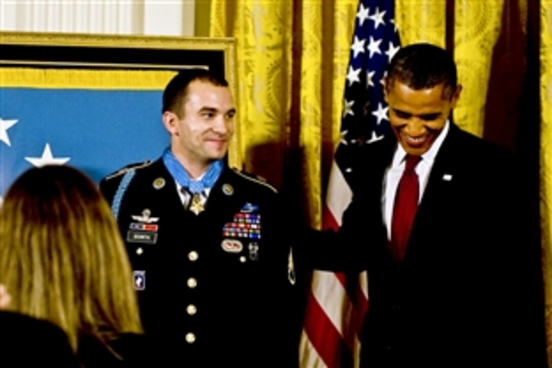 President Barack Obama congratulates  U.S. Army Staff Sgt. Salvatore Giunta after presenting him with the Medal of Honor at the White House in Washington, D.C., Nov. 16, 2010. 