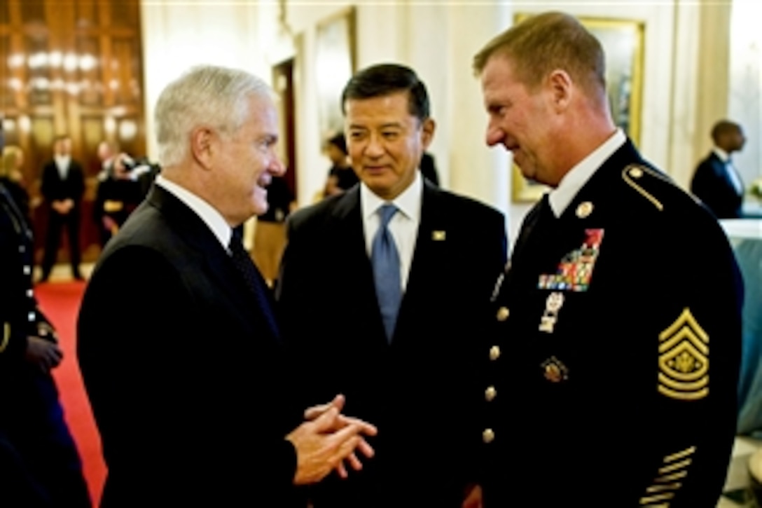 Defense Secretary Robert M. Gates, Veteran Affairs Secretary Eric Shinseki and Sgt. Maj. of the Army Kenneth O. Preston talk before Staff Sgt. Salvatore Giunta's Medal of Honor ceremony at the White House in Washington, D.C., Nov. 16, 2010.