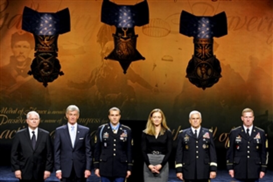 From left to right: Defense Secretary Robert M. Gates, Army Secretary John McHugh, Medal of Honor recipient Army Staff Sgt. Salvatore Giunta, his wife Jennifer Giunta, Army Chief of Staff Gen. George W. Casey Jr. and Sgt. Maj. of the Army Kenneth O. Preston listen to Giunta's citation during his induction ceremony into the Hall of Heroes at the Pentagon, Nov. 17, 2010. Giunta is the award's first living recipient since the Vietnam War.