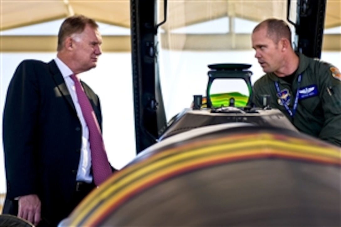 Deputy Defense Secretary William J. Lynn III receives a mission brief on the F-16 Falcon jet fighter by U.S. Air Force Major Bryan Unks on the flightline of Luke Air Force Base, Ariz., Nov. 17, 2010. Unks is assigned to the 309th Fighter Squadron.