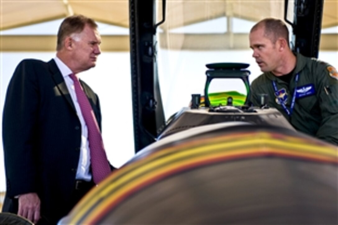 Deputy Defense Secretary William J. Lynn III receives a mission brief on the F-16 Falcon jet fighter by U.S. Air Force Major Bryan Unks on the flightline of Luke Air Force Base, Ariz., Nov. 17, 2010. Unks is assigned to the 309th Fighter Squadron.