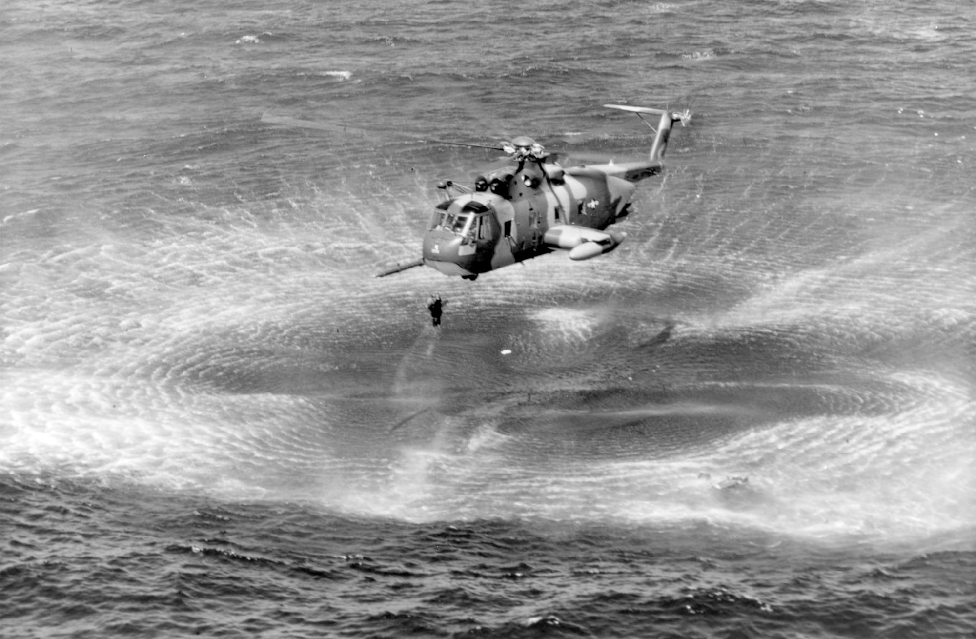 A USAF HH-3E rescues a pilot from the water off the coast of Vietnam. (U.S. Air Force photo)