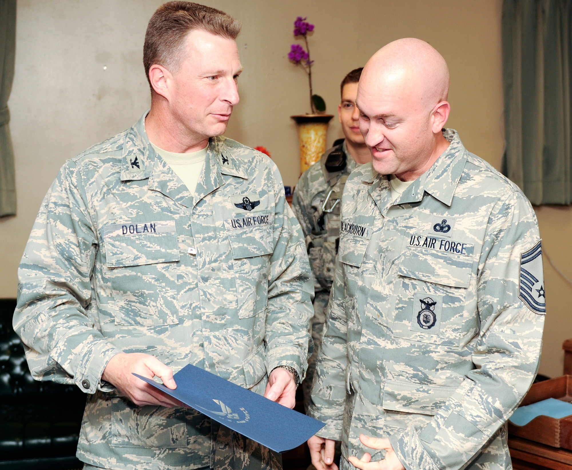 KUNSAN AIR BASE, Republic of Korea -- Col. John Dolan, 8th Fighter Wing commander, congratulates Senior Master Sgt. Troy Blackburn, 8th Security Forces Squadron, on his selection to chief master sergeant Nov. 18. (U.S. Air Force photo/Staff Sgt. Jonathan Pomeroy)