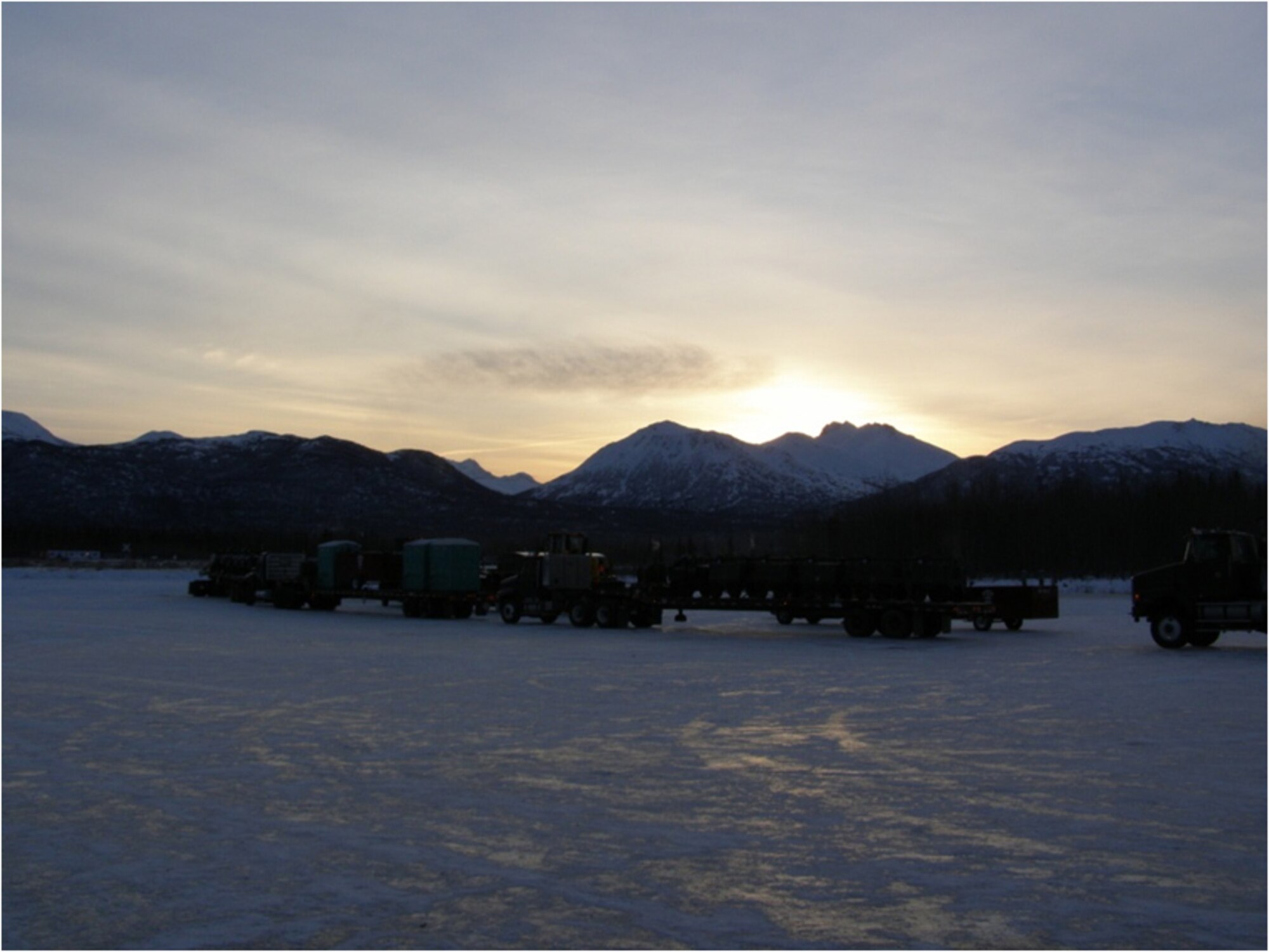 F-22 Aircraft Recovery Operation Ground Support, 18 November 2010, JOINT BASE ELMENDORF-RICHARDSON, Alaska.  Convoy ready to move at dawn.  (U.S. Air Force courtesy photo)

