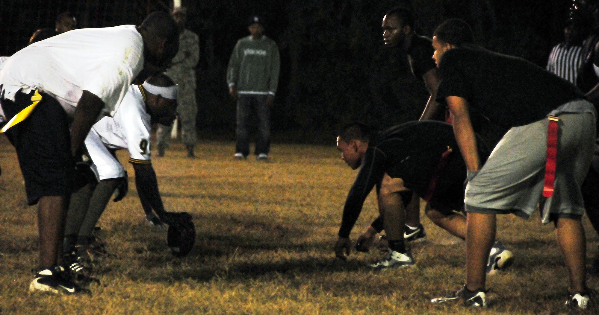 Players from the 628th Logistics Readiness Squadron, left, face off against the 628th Force Support Squadron during a flag football game on Joint Base Charleston, S.C., Nov. 16, 2010. Despite the efforts of the 628 FSS, the 628 LRS emerged the victors of the game, winning 15-14. (U.S. Air Force photo/Staff Sgt. Daniel Bowles)