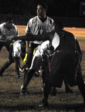 Bobby Degregorio, back, listens in as David Johnson, front, calls an audible at the goal line, preparing to defend against the 628th Logistics Readiness Squadron football team during their fourth down Nov. 16, 2010, on Joint Base Charleston, S.C. The flag football season so far has seen approximately 30 games played, and will continue into December with approximately 20 games to go in the regular season. Johnson plays for the the 628th Force support squadron football team, and Degregorio plays for the 628 LRS. (U.S. Air Force photo/Staff Sgt. Daniel Bowles)