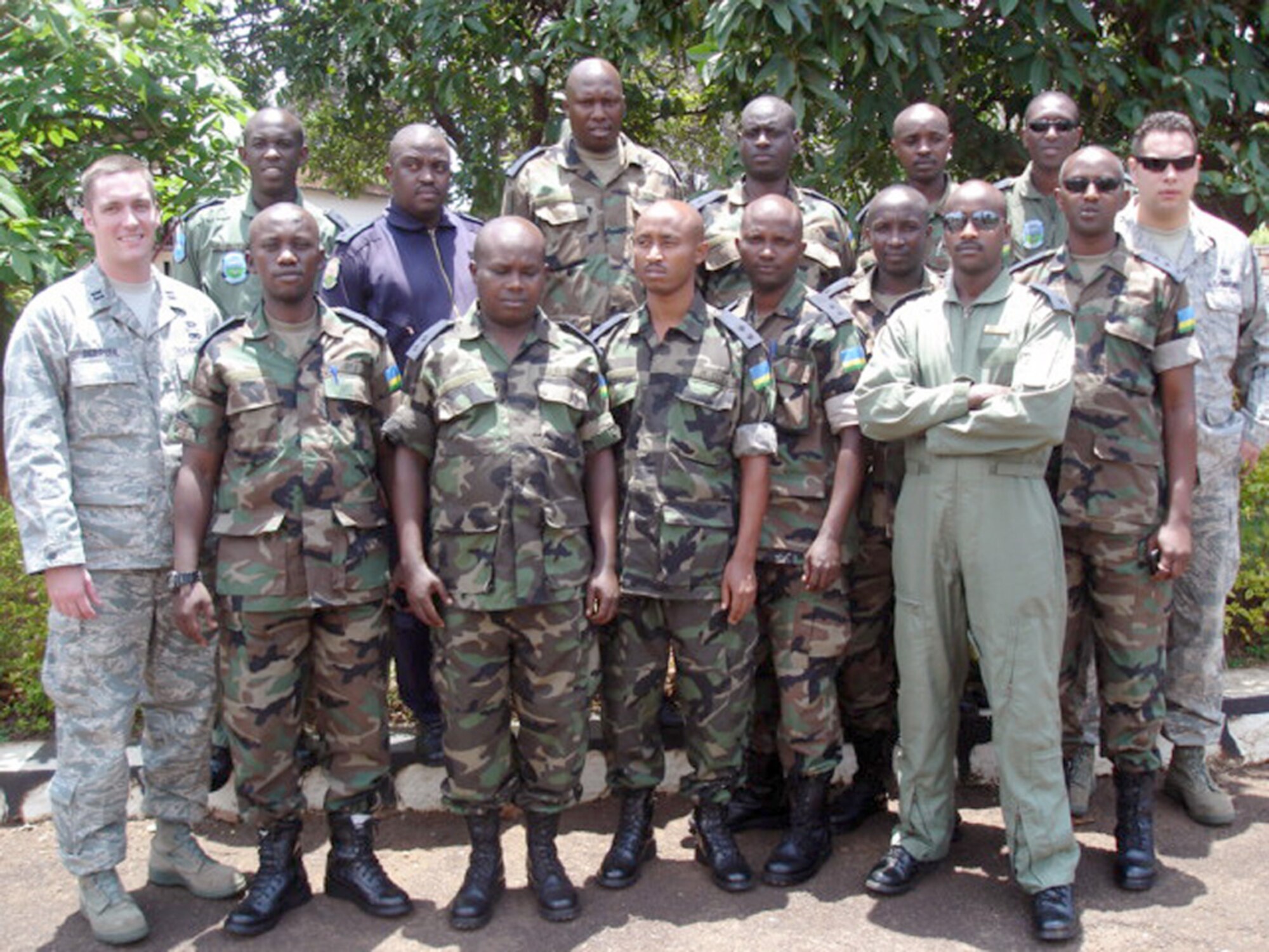 Capt. Brian DeBruhl (far left) and Tech. Sgt. Brandon Macken (far right, second row) pose for a photo with officers from the Rwanda air force. The pair traveled to Rwanda to help train the officers in aircraft maintenance and logistics and to conduct a maintenance management training course. Captain DeBruhl is the 373rd Training Squadron's Detachment 4 commander. Sergeant Macken is a 373rd TRS Det. 4 instructor. (Courtesy photo) 