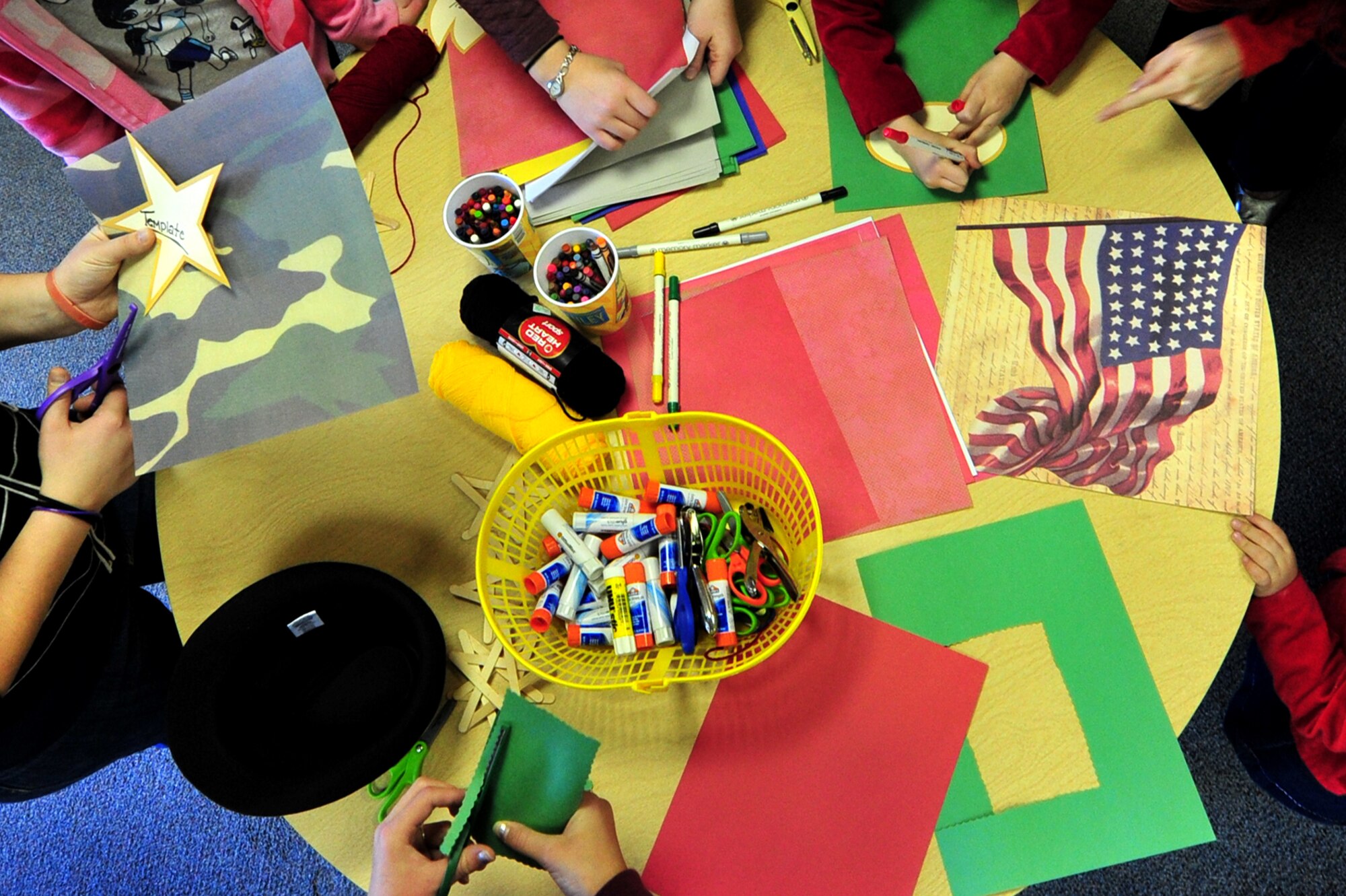 Handmade ornaments are constructed for a Heroes' Tree Dedication ceremony at the base library, Nov. 14, 2010. Our Heroes' Tree is a community outreach program co-founded in 2005 by Stephanie Pickup, author of The Soldiers' Tree, and Marlene Lee, author of The Hero in My Pocket. This program promotes awareness of the service and sacrifice of U.S. service members and their families. (U.S. Air Force photo by Tech Sgt. Josef Cole)(RELEASED) 
