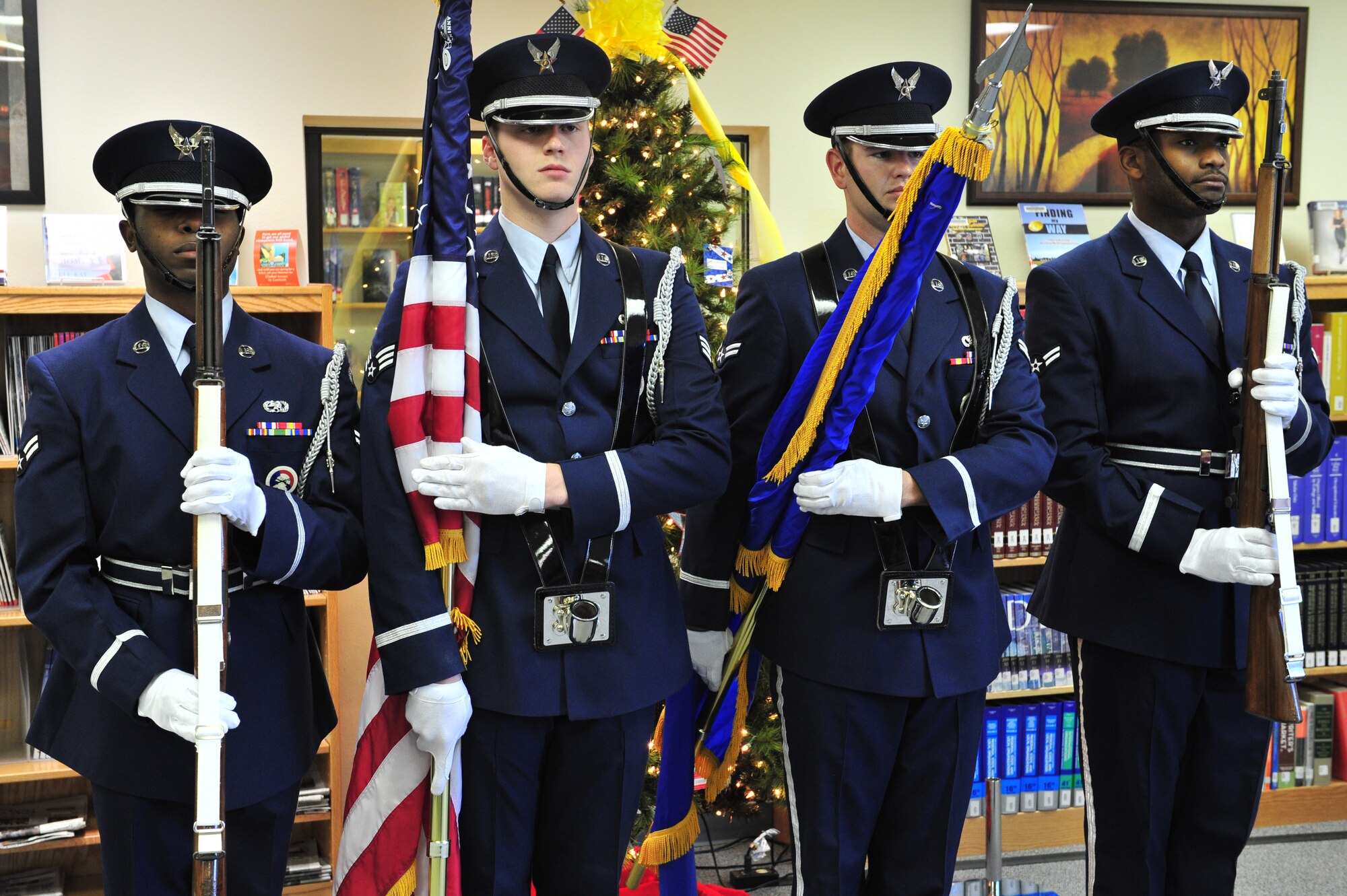 Members of the Cannon Air Force Base Honor Guard post the colors at the being of a Heroes' Tree Dedication ceremony at the base library, Nov. 14, 2010. Our Heroes' Tree is a community outreach program co-founded in 2005 by Stephanie Pickup, author of The Soldiers' Tree, and Marlene Lee, author of The Hero in My Pocket. This program promotes awareness of the service and sacrifice of U.S. service members and their families. (U.S. Air Force photo by Tech Sgt. Josef Cole)(RELEASED) 