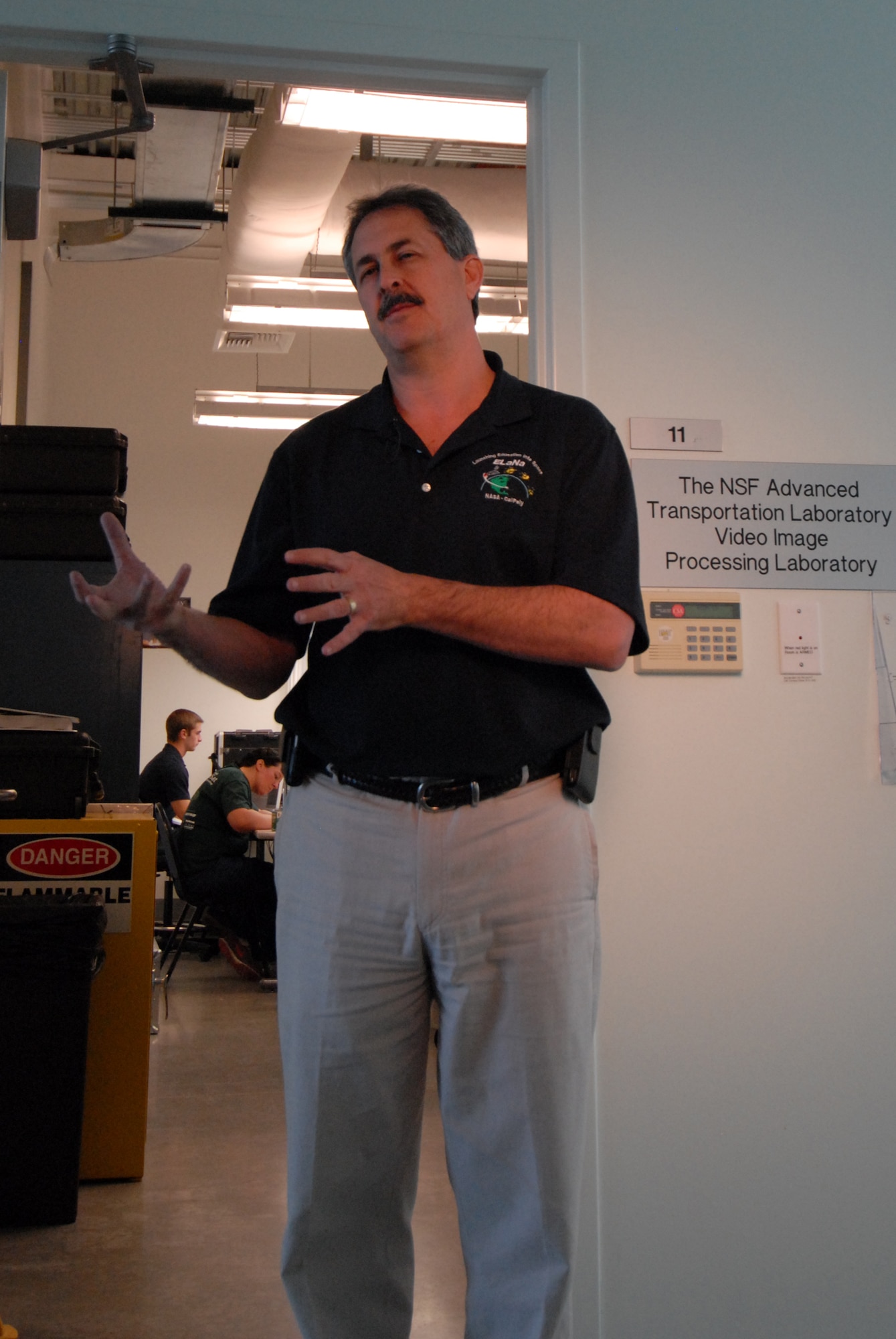 SAN LUIS OBISPO, Calif. – Larry Fineberg, NASA systems and integration
engineer, explains the partnership between NASA and several universities to launch mini research satellites, or CubeSats, and deploy them using a Poly Picosatellite Orbital Deployer, or PPOD, container. The PPOD and CubeSat Project were developed by California Polytechnic State University and Stanford University’s Space Systems Development Lab for use on NASA’s Educational Launch of Nanosatellite, or ELaNa missions. Each CubeSat measures about four inches cubed; about the same volume as a quart. The CubeSats weigh about 2.2 pounds, must conform to standard aerospace materials and must operate without propulsion. (U.S. Air Force photo/ Jerry E. Clemens, Jr.)