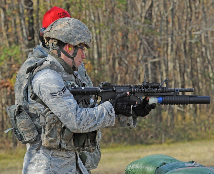 Airman 1st Class Steven Whaley, 91st Security Forces Squadron Tactical Response Force, Minot Air Force Base, N.D., loads his M203 grenade launcher during the Global Strike Challenge Nov. 16 at Barksdale AFB, La. The competition is Air Force Global Strike Command's first, command-wide competition. (U.S. Air Force photo/Airman 1st Class Sean Martin)(Released)