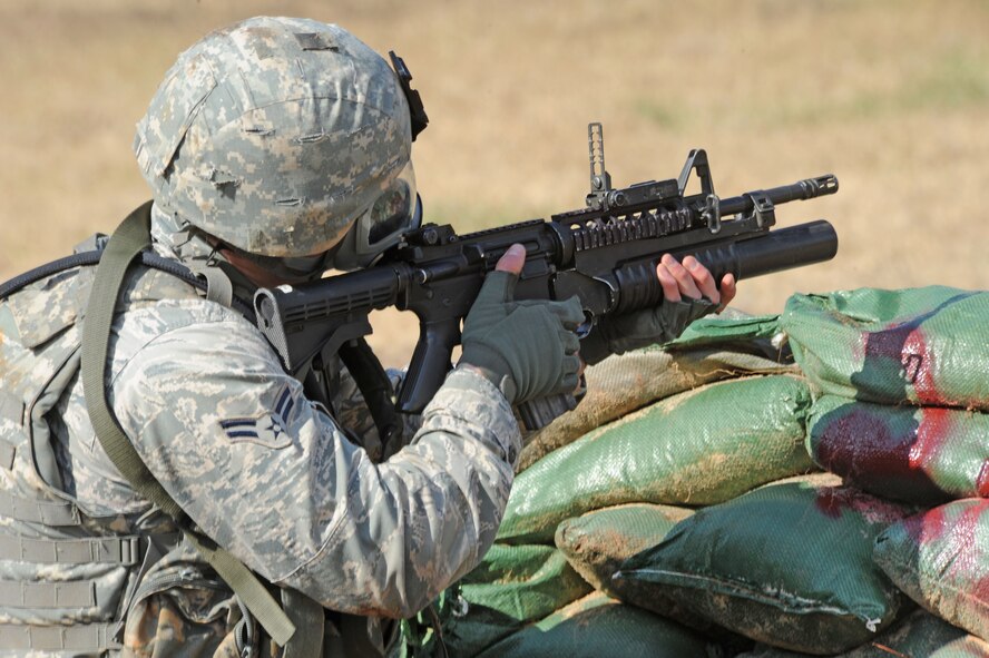 Airman 1st Class Ryan Fontaine, 91st Security Forces Squadron Convoy Response Force, Minot Air Force Base, N.D., fires his M203 grenade launcher during the Global Strike Challenge Nov. 16 at Barksdale AFB, La. The challenge is held to showcase the world's premier bomber and Intercontinental Ballistic Missile force. The events foster esprit de corps through competition and teamwork. (U.S. Air Force photo/Airman 1st Class Sean Martin)(Released)