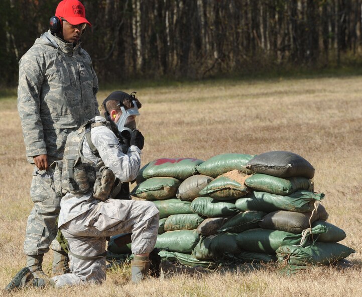 Airman 1st Class Steven Whaley, 91st Security Forces Squadron Tactical Response Force, Minot Air Force Base, N.D., dons his gas mask during the Global Strike Challenge Nov. 16 at Barksdale AFB, La. The GSC is the Air Force Global Strike Command's first, command-wide competition. (U.S. Air Force photo/Airman 1st Class Sean Martin)(Released)