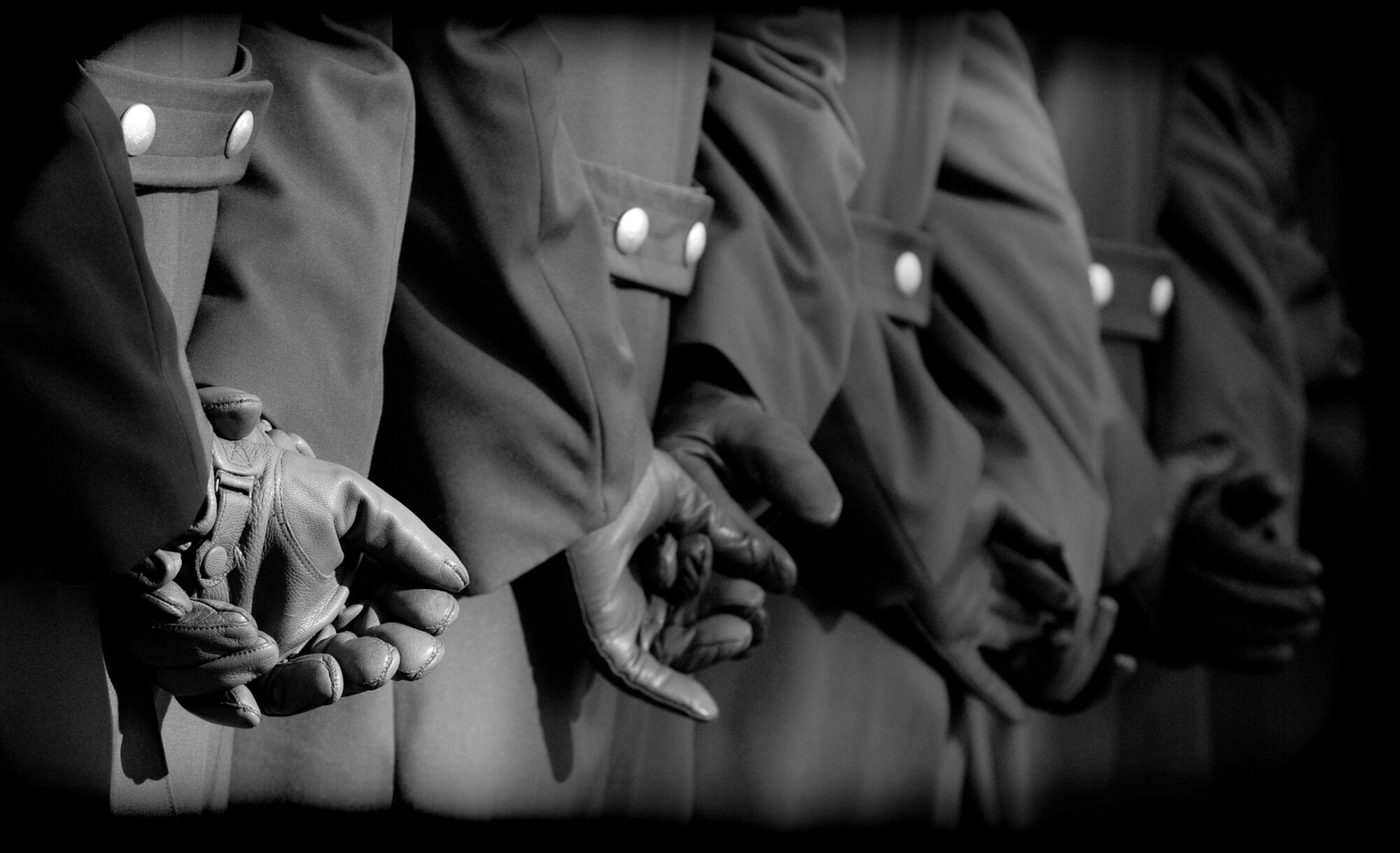 German soldiers stand at parade rest during a ceremony for Volkstrauertag, or German National Day of Mourning, Nov. 11, 2010, at Bitburg, Germany. German and American servicemembers as well as firefighters, police and government officials from the local area participated in the ceremony to remember victims of war and tyranny. (U.S. Air Force photo/Staff Sgt. Benjamin Wilson)