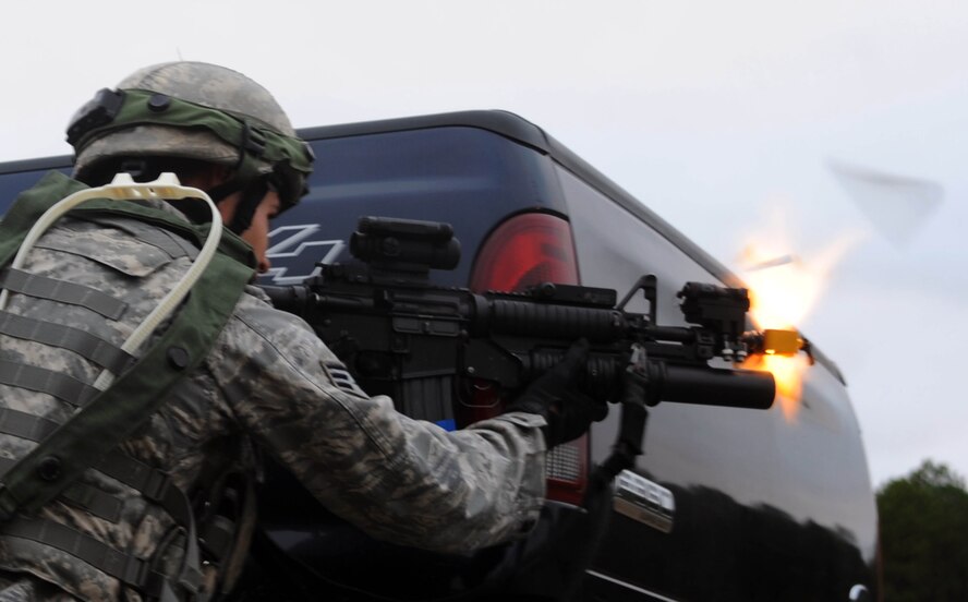 Senior Airman Johnathan Byron, 28th Security Forces Squadron from Ellsworth Air Force Base, S.D., fires his weapon during the tactics portion of Global Strike Challenge at Camp Minden, La., Nov. 13. The competition includes security forces along with missile and bomber forces from Air Force Global Strike Command. Teams have the opportunity to participate in innovative thinking, teamwork and esprit de corps. (U.S. Air Force photo/Senior Airman Brittany Y. Bateman)(RELEASED)