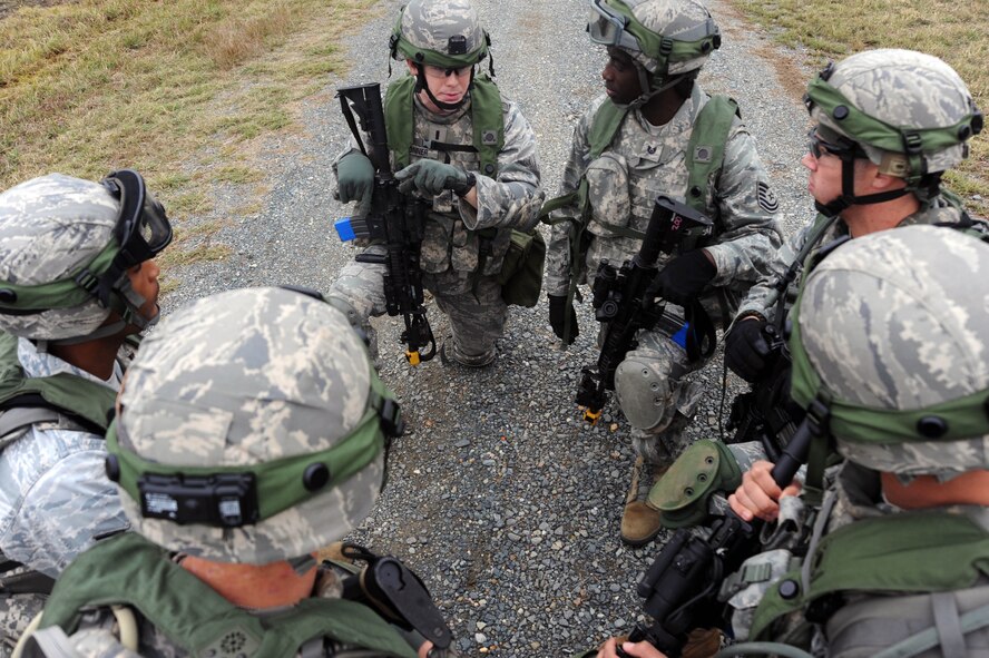 Members of Barksdale?s 2nd Security Forces Squadron discuss their plan during the tactics portion of the Global Strike Challenge at Camp Minden, La., Nov. 13.  Global Strike Challenge is the world's premier bomber, Intercontinental Ballistic Missile and security forces competition with units from Air Force Global Strike Command, Air Combat Command, Air Force Reserve Command and the Air National Guard. (U.S. Air Force photo/Senior Airman Brittany Y. Bateman)(RELEASED)