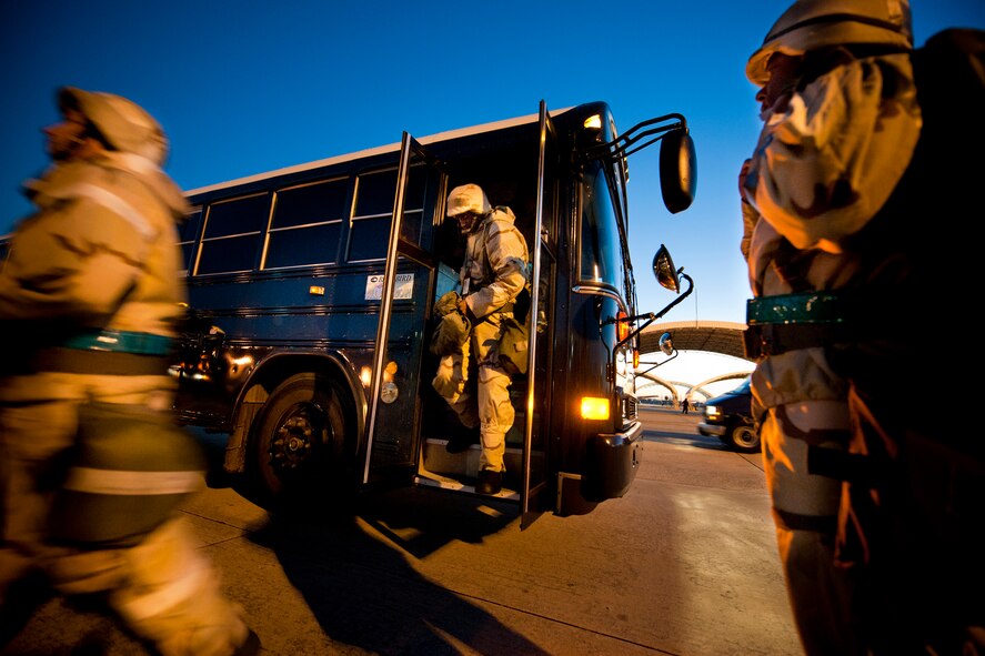 MOODY AIR FORCE BASE, Ga. -- Participants in a Phase II Operational Readiness Exercise enter and exit a transport bus Nov. 17. Transport buses ran regularly during the exercise to ensure personnel got to and from their duty locations. The exercise tested and trained the base's ability to perform in a deployed location. (U.S. Air Force photo/Senior Airman Jamal D. Sutter)(RELEASED)