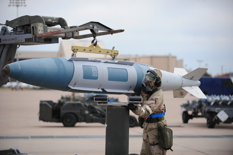 DYESS AIR FORCE BASE, Texas-- Airman 1st Class John Piersall, 7th Aircraft Maintenance Squadron, unloads a bomb from a jammer Nov. 15 during an Operational Readiness Exercise here. OREs are conducted to test the capabilities and efficiencies of Airmen to ensure they are prepared for real world events. (U.S Air Force photo/ Airman 1st Class Shannon Hall)  