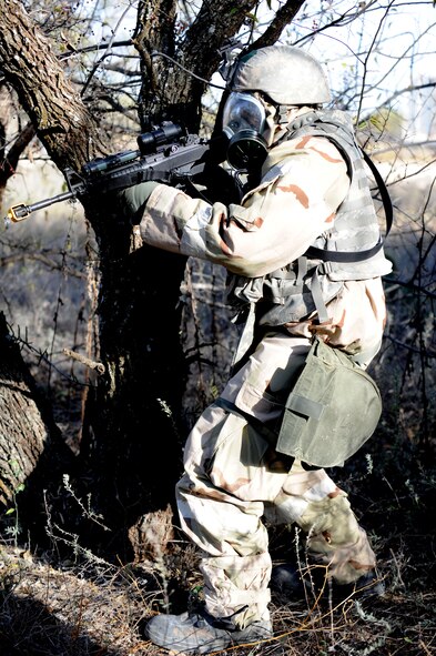 DYESS AIR FORCE BASE, Texas—Staff Sgt. Stuart Williams, 7th Security Forces Squadron, keeps a watch out for insurgents while returning to his post Nov. 15 during an Operational Readiness Exercise here.  OREs are conducted to test the capabilities and efficiencies of Airmen to ensure they are prepared for real world events. (U.S Air Force photo/ Airman 1st Class Shannon Hall)  