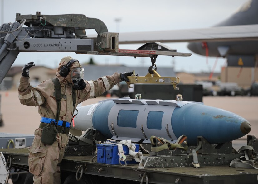 DYESS AIR FORCE BASE, Texas—Airman 1st Class John Piersall, 7th Aircraft Maintenance Squadron, loads a bomb onto a jammer Nov. 15 during an Operational Readiness Exercise here. OREs are conducted to test the capabilities and efficiencies of Airmen to ensure they are prepared for real world events. (U.S Air Force photo/ Airman 1st Class Shannon Hall)  