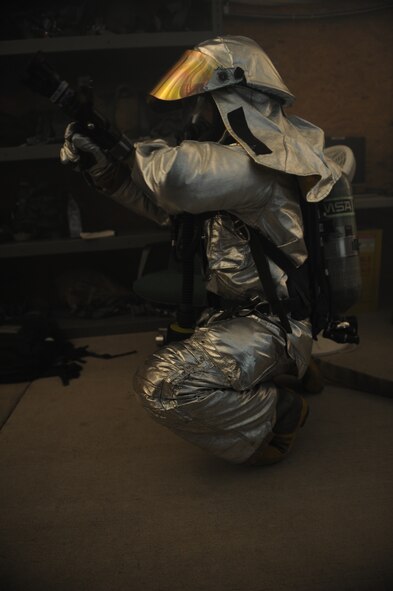 DYESS AIR FORCE BASE, Texas—Airman Zack Weldon, 7th Civil Engineer Squadron firefighter, simulates putting out a fire Nov. 14 during an Operational Readiness Exercise here. OREs are conducted to test the capabilities and efficiencies of Airmen to ensure they are prepared for real world events. (U.S Air Force photo/ Airman 1st Class Shannon Hall) 