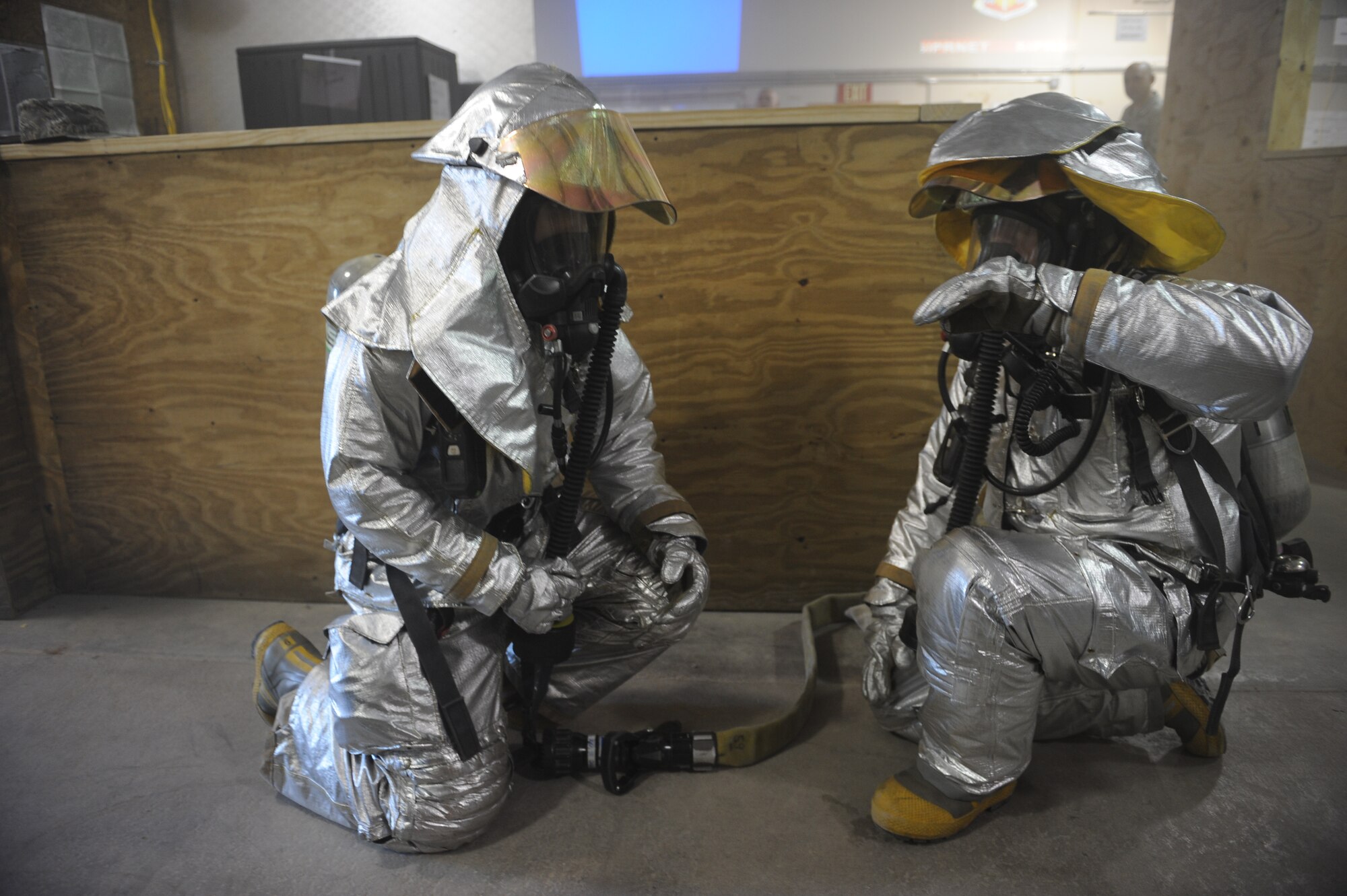 DYESS AIR FORCE BASE, Texas—( left to right) Airman Zack Weldon and Staff Sgt. Timothy Butler, 7th Civil Engineer Squadron firefighters, communicate with each other Nov. 14 during an Operational Readiness Exercise here. OREs are conducted to test the capabilities and efficiencies of Airmen to ensure they are prepared for real world events. (U.S Air Force photo/ Airman 1st Class Shannon Hall)  