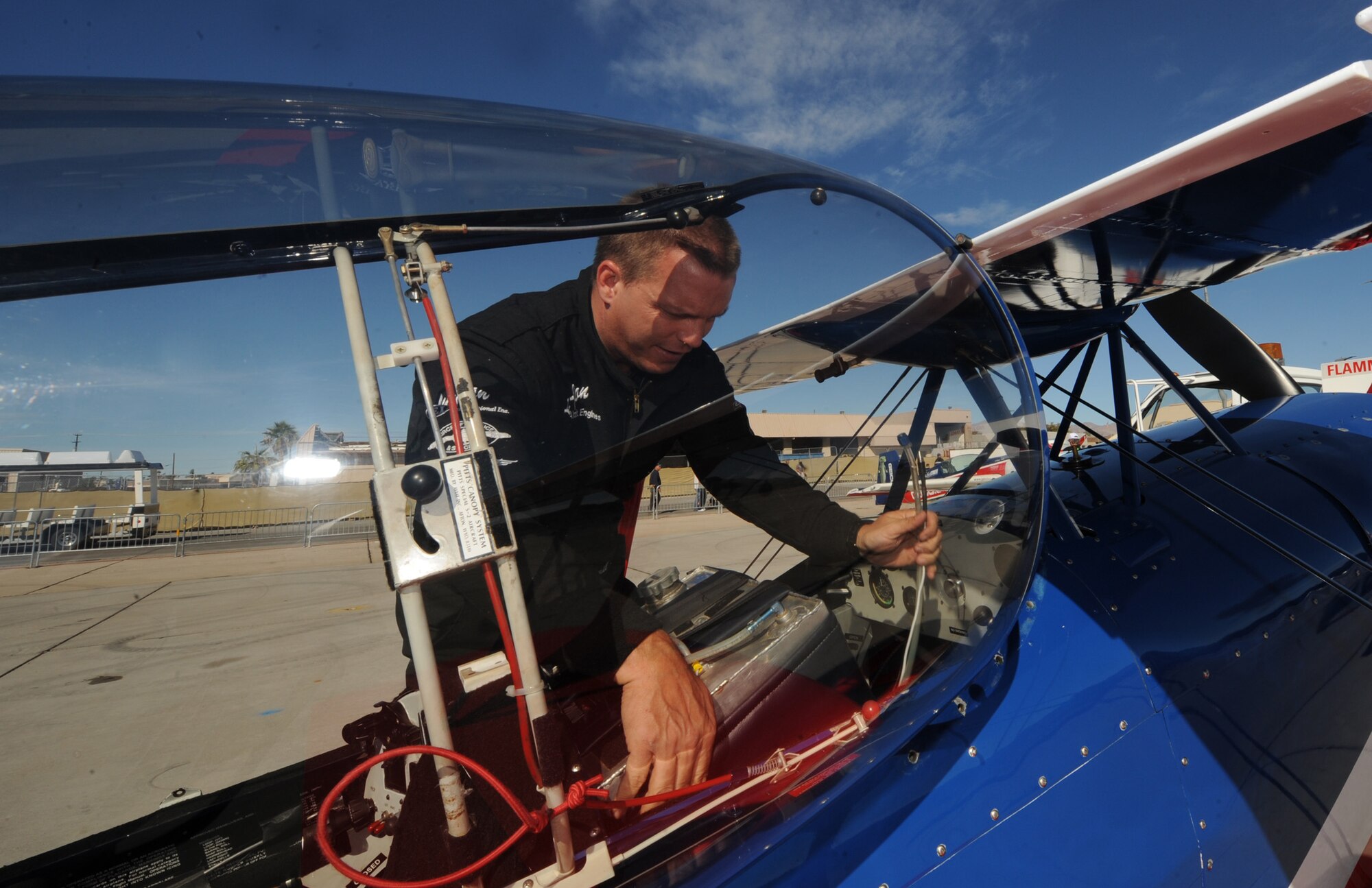 NELLIS AIR FORCE BASE, Nev.-- Lt. Col. Ed Hamill, U.S. Air Force reservist, post flights his Biplane on Nov. 14, 2010 during Aviation Nation, Nellis Air Force Base Open House and annual Las Vegas air show. "As a member of the Air Force Reserve, I can contribute to the security of my country, yet I have the time to pursue my full time career as an aerobatic pilot. To fly an F-16 and then, hours later, my biplane is my dream come true," said Hamill.  (U.S. Air Force photo/ Master Sgt. Kevin J. Gruenwald) (Released)





