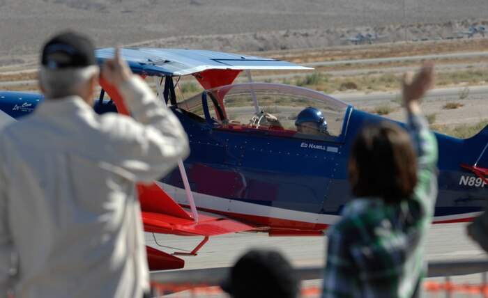 NELLIS AIR FORCE BASE, Nev.-- The crowd waves to Lt. Col. Ed Hamill, U.S. Air Force reservist, after completing his performance  Nov. 14, 2010 during Aviation Nation, Nellis Air Force Base Open House and annual Las Vegas air show.  Lt. Col. Hamill is also an F-16 instructor pilot at Luke Air Force Base, AZ., and just recently completed a four month deployment.  (U.S. Air Force photo/ Master Sgt. Kevin J. Gruenwald)(Released)



