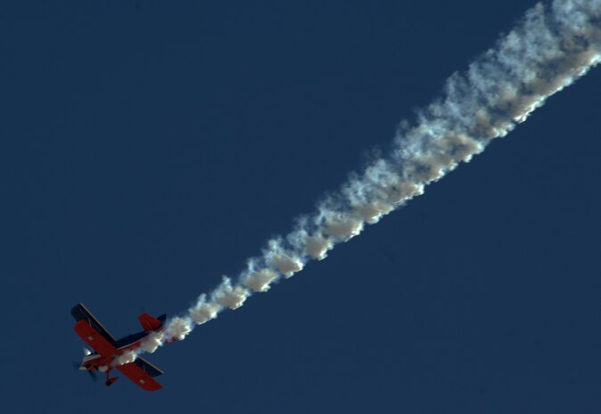 NELLIS AIR FORCE BASE, Nev.-- Lt. Col. Ed Hamill, U.S. Air Force reservist, maneuvers his biplane for the crowd of thousands on Nov. 14, 2010 during Aviation Nation, Nellis Air Force Base Open House and annual Las Vegas air show.  Ed combines the history of airshow flying with his message to  set goals, work hard and never give up.  (U.S. Air Force photo/ Master Sgt. Kevin J. Gruenwald)(Released)



