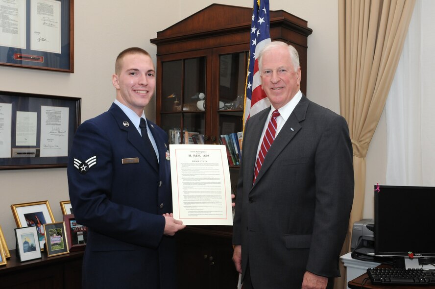 JOINT BASE ANDREWS, Md. -- Senior Airman Joshua Powell, 779th Medical Operations Squadron respiratory therapist, poses with U.S. Congressman Mike Thompson and a copy of the U.S. House of Representative Resolution 1605 at the Canon House Office Building, Washington DC Nov. 17. Airman Powell joined other Team Andrews servicemembers from various medical-related career fields in meeting Congressman Thompson in DC. Congressman Thompson sponsored the passing of House Resolution 1605, which recognizes all Airmen who support the Aeromedical Evacuation mission. He requested to meet with local Airmen on the 17th in conjunction with passing the resolution. (U.S. Air Force photo/Tech. Sgt. Steve Lewis)