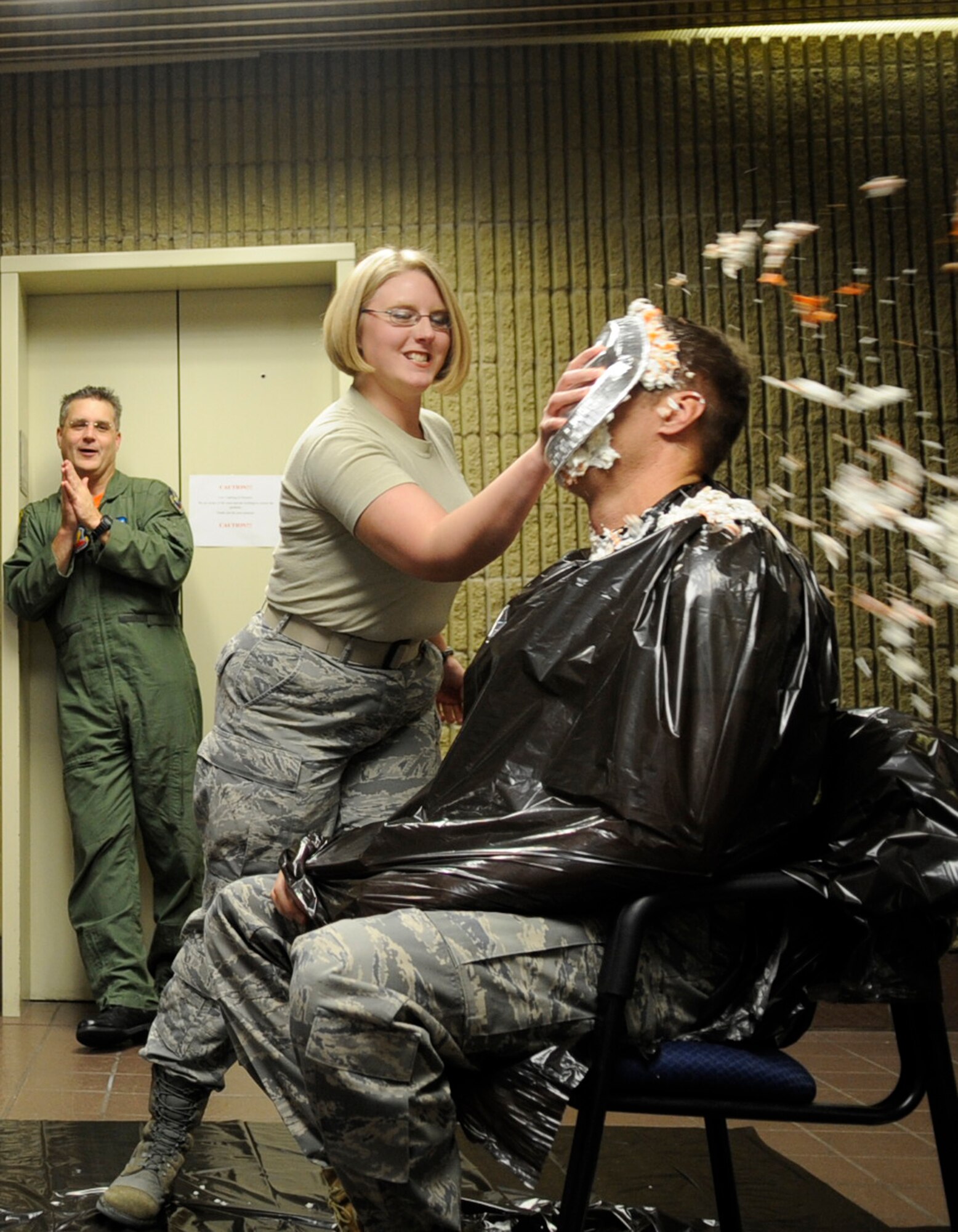 MOUNTAIN HOME AIR FORCE BASE, Idaho -- Senior Airman Anastacia Rohde, 366th Comptroller Squadron Financial Management Flight, slams Capt. Lucas Choate, 366th Fighter Wing executive officer, with a pie during the 2010 Pie in the Eye fundraiser held at the wing headquarters building Nov. 12. Members of the fighter wing staff participated in the auctioning of three pies and raised more than $500 in support of the 2010 Combined Federal Campaign. (U.S. Air Force photo by/Senior Airman Angelina Drake)