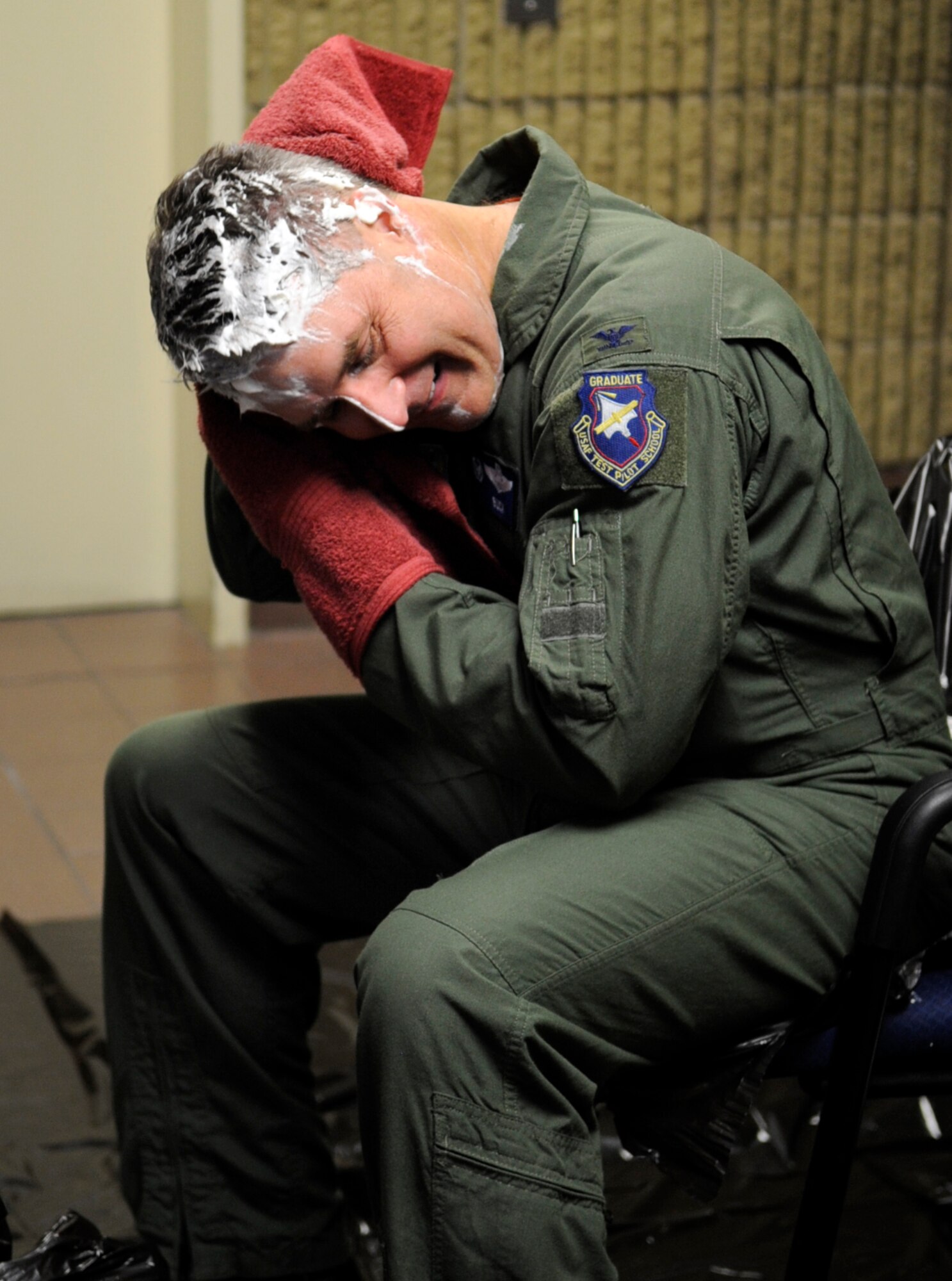 MOUNTAIN HOME AIR FORCE BASE, Idaho -- Col. Ron Buckley, 366th Fighter Wing commander, removes whipped cream from his face during the 2010 Pie in the Eye fundraiser here Nov. 12. Members of the fighter wing staff participated in the auctioning of three pies and raised more than $500 in support of the 2010 Combined Federal Campaign. (U.S. Air Force photo by/Senior Airman Angelina Drake)