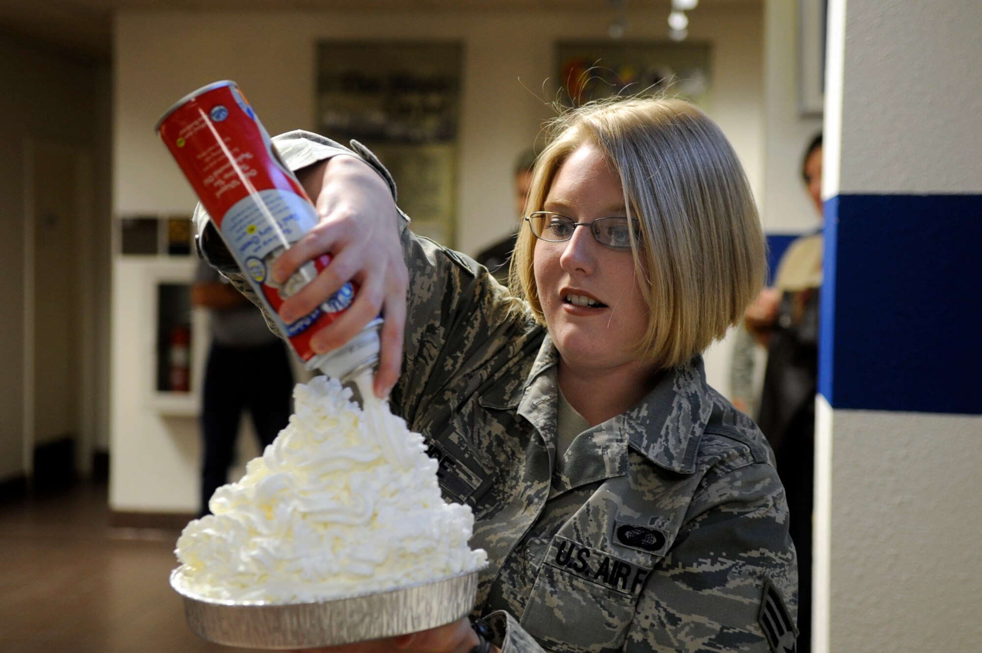 MOUNTAIN HOME AIR FORCE BASE, Idaho -- Senior Airman Anastacia Rohde, 366th Comptroller Squadron financial management flight, prepares a pie before the 2010 Pie in the Eye fundraiser held at the wing headquarters building Nov. 12. Members of the fighter wing staff participated in the auctioning of three pies and raised more than $500 in support of the 2010 Combined Federal Campaign.(U.S. Air Force photo by/Senior Airman Angelina Drake)