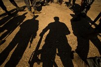 Security forces Airmen discuss how they performed during ground tactics training with the cadre Nov. 2 at Camp Bullis. Airmen attending Combat Leadership Course gain leadership experience from classroom and field training in land navigation, convoy operations, mounted and dismounted patrols and urban warfare. (U.S. Air Force photo/Staff Sgt. Jonathan Snyder)