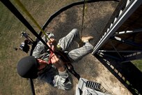 Staff Sgt. William Hierholzer, Combat Leadership Course instructor, self rescues during rappel masters certification course Nov. 5 at Camp Bullis. Individuals attending the five day rappel course learn 13 different knots, how to self rescue if stuck and descend down the wall and free side safely. (U.S. Air Force photo/Staff Sgt. Jonathan Snyder)      