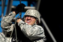 Staff Sgt. Omar Vargas, Combat Casualty Care Course instructor, attempts to self rescues during rappel masters certification course Nov. 5 at Camp Bullis. Individuals attending the five day rappel course learn 13 different knots, how to self rescue if stuck and descend down the wall and free side safely. (U.S. Air Force photo/Staff Sgt. Jonathan Snyder)   