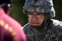 Army Spc. Gregoria Herrera, Defense Medical Readiness Training Institute, has second thoughts about rappelling Nov. 5 at Camp Bullis. Individuals attending the five day rappel masters certification course learn 13 different knots, how to self rescue if stuck and descend down the wall and free side safely. (U.S. Air Force photo/Staff Sgt. Jonathan Snyder) 