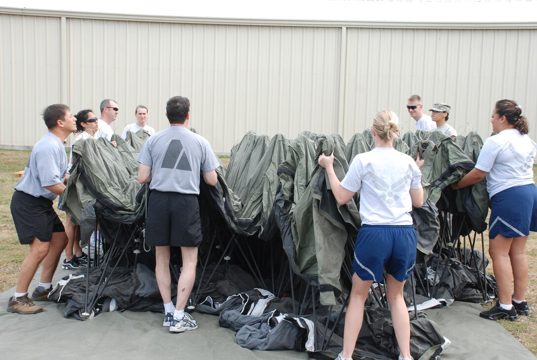 SOTO CANO AIR BASE, Honduras -- Members of the Joint Task Force-Bravo Medical Element train on setting up a Deployable Rapid Assembly Shelter here Nov. 18. The DRASH is a complete system that provides shelter, mobility, lighting, heating, cooling and power distribution in one package to form a total infrastructure solution.  DRASH has been deployed by the U.S. military and NATO forces for more than 20 years to establish rugged, user-friendly command and control centers, rapidly deployable medical treatment facilities, life support areas, and maintenance and logistics support facilities. (U.S. Air Force photo/Capt. John T. Stamm)