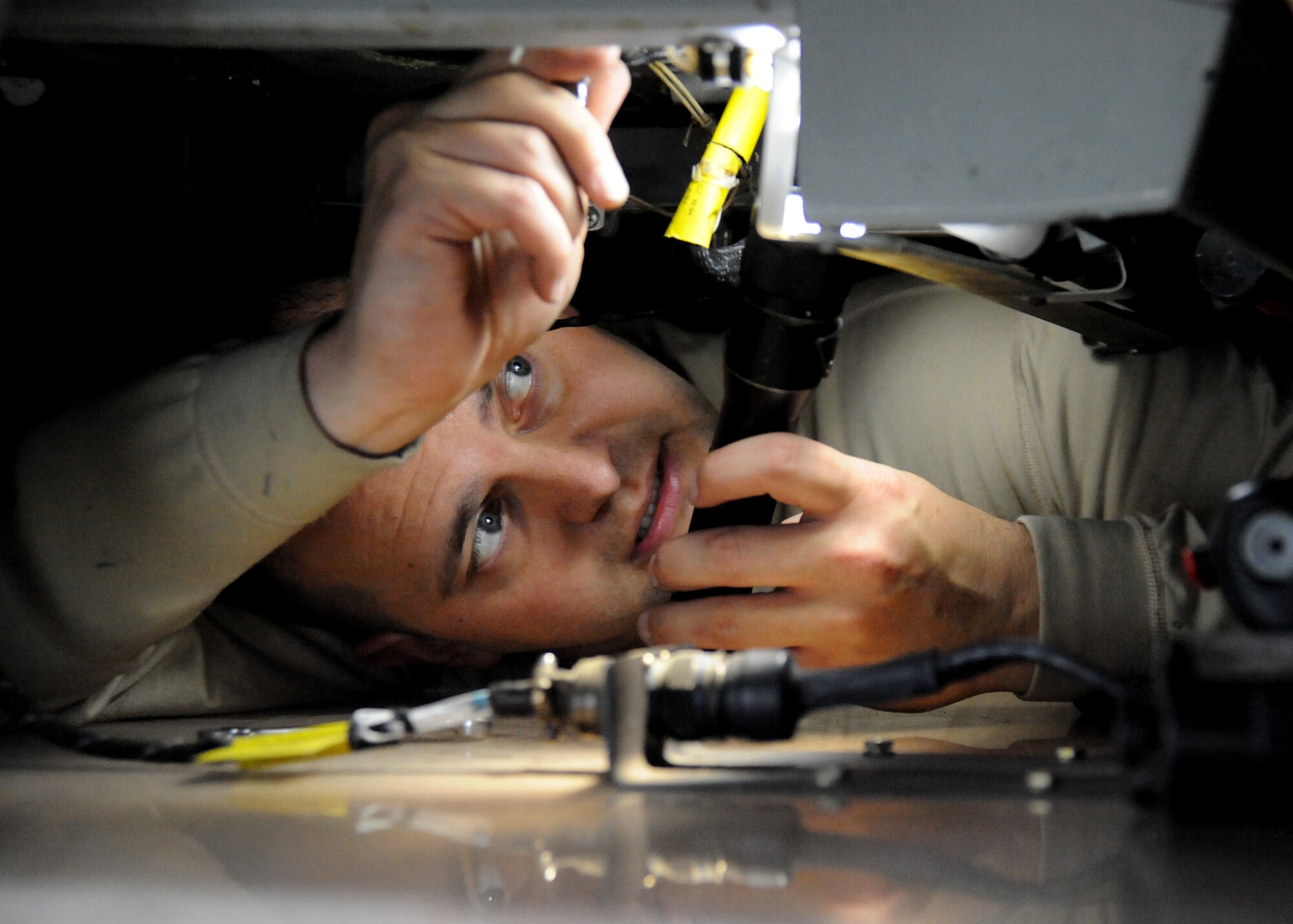 Senior Airman Kyle Burks, 22nd Maintenance Squadron electro-environmental systems journeyman, repairs a mount for a map light in the cockpit of a KC-135 Stratotanker as part of an isochronal inspection, Nov. 16, 2010, McConnell Air Force Base, Kan. During ISO inspections, maintainers inspect the aircraft, to improve the overall health of McConnell’s fleet.  (U.S. Air Force photo/Airman 1st Class Katrina M. Brisbin)