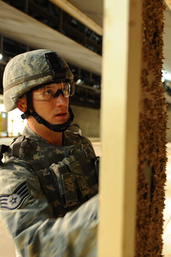 ELLSWORTH AFB, S.D. – Staff Sgt. Tyson Steiger, 28th Security Forces Squadron assistant unit deployment manager, calculates the score of an Airman shooting, Nov. 9. Sergeant Steiger is part of a seven person team who will be participating in the Global Strike Challenge, Nov. 13 through 16. The challenge pits missile and bomb crews, security forces, and maintainers from five Air Force Bases in head-to-head competitions as each seek to be recognized as the “best of the best.” (U.S. Air Force photo/Senior Airman Kasey Close)