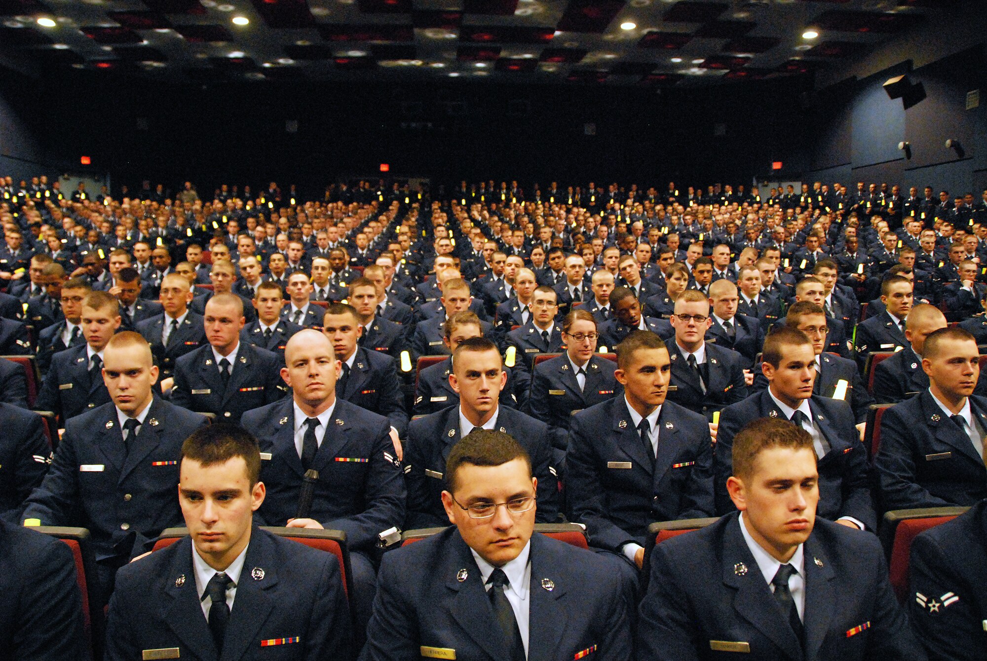 Airmen fill a standing-room only base theater Nov. 15 to honor Airman 1st Class Dustin J. Curley, an Airman in Training at the 362nd Training Squadron at Sheppard Air Force Base who was killed in a vehicle accident in early November. This "sea of blue" was made up of active duty, Air Force Reserve and Air National Guard Airmen, a representation of the Air Force's Total Force. (U.S. Air Force photo/Mike Litteken)
