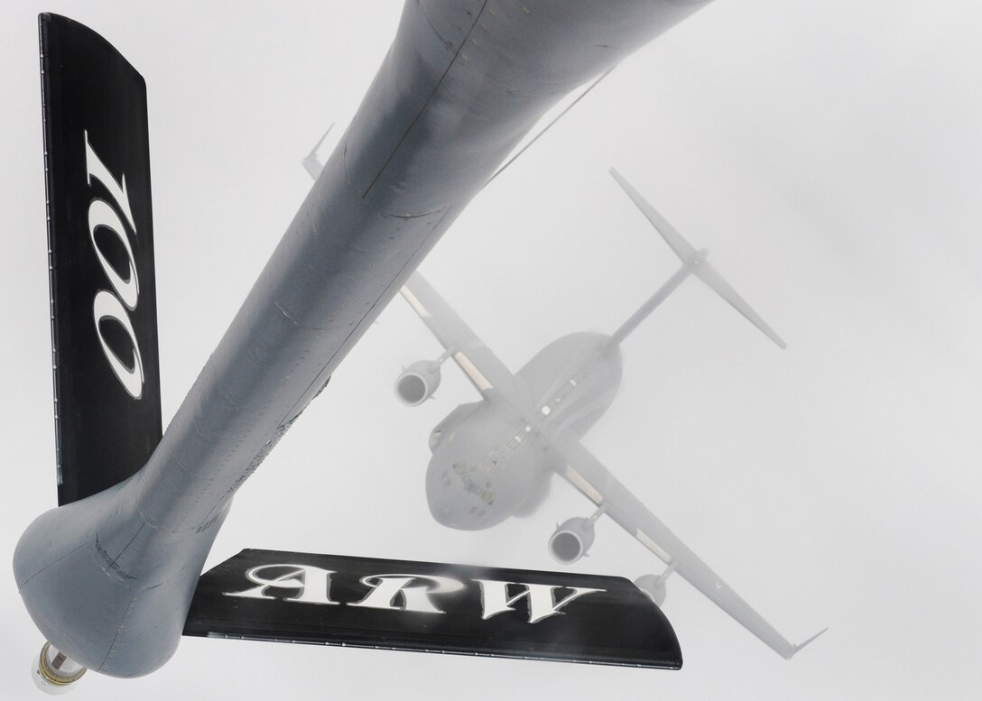 A C-17 Globemaster III approaches a KC-135 Stratotanker boom over Germany Nov. 12, 2010, during a training mission.  The C-17 is with the Heavy Airlift Wing at Papa Air Base, Hungary, and the KC-135 is from the 100th Air Refueling Wing at Royal Air Force Mildenhall, England. (U.S. Air Force photo/Senior Airman Tabitha M. Lee)